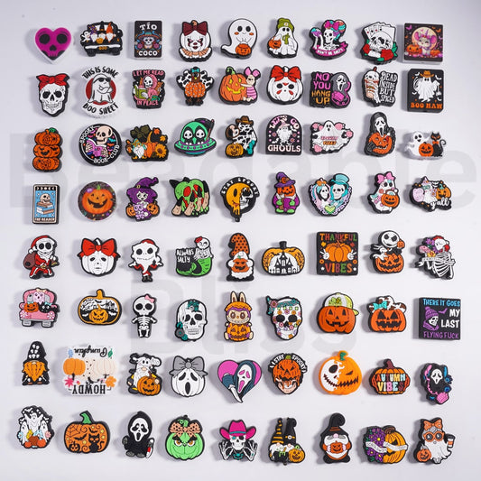 Collection of Halloween-themed pins on a white background

