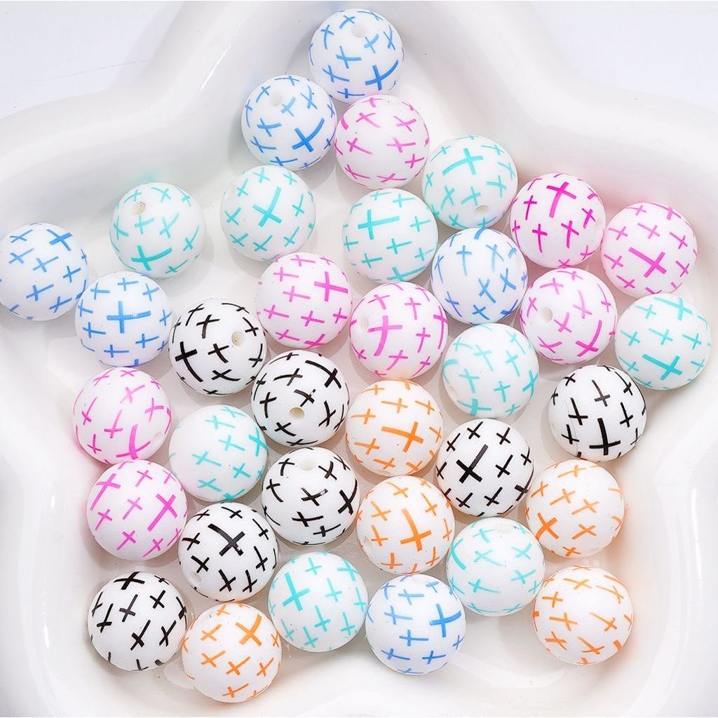 Colorful round beads with various patterns on a white background

