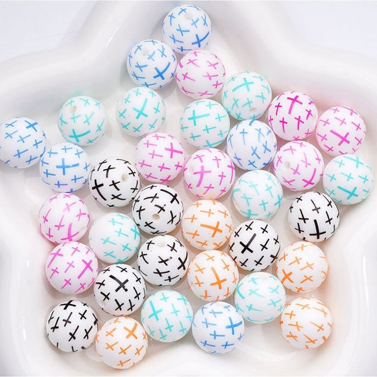 Colorful round beads with various patterns on a white background

