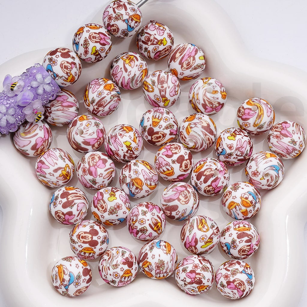 Colorful marbled beads on a white surface

