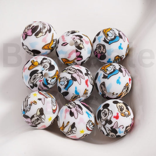 Set of round decorative items with cartoon character designs on a white background


