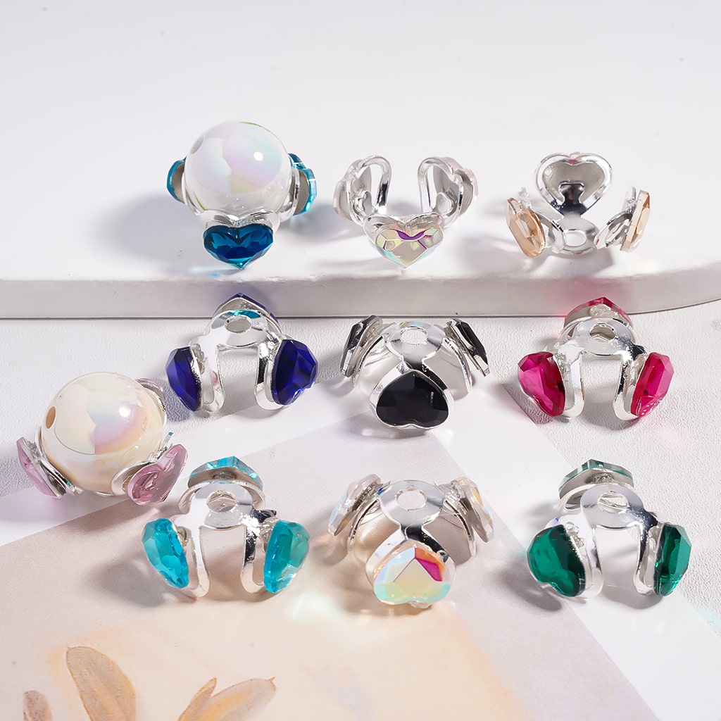 Set of colorful heart-shaped earrings on a white background