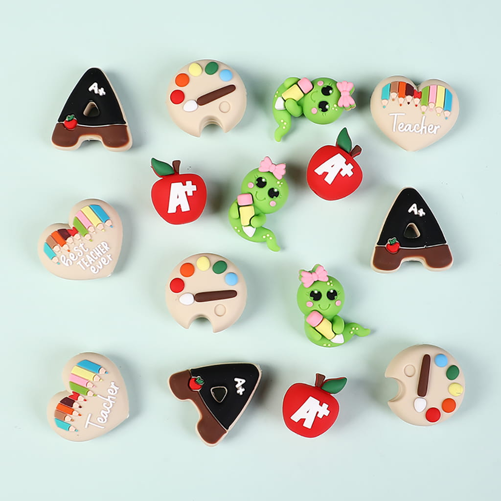 Collection of colorful educational-themed cookies on a light blue background