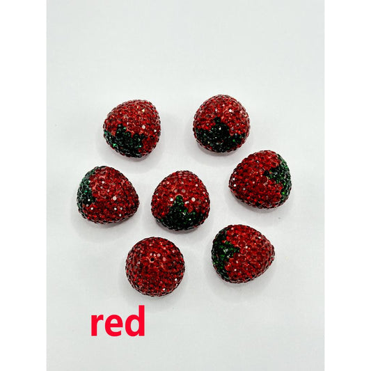 Red glittery strawberry-shaped objects on a white background with 'red' text.

