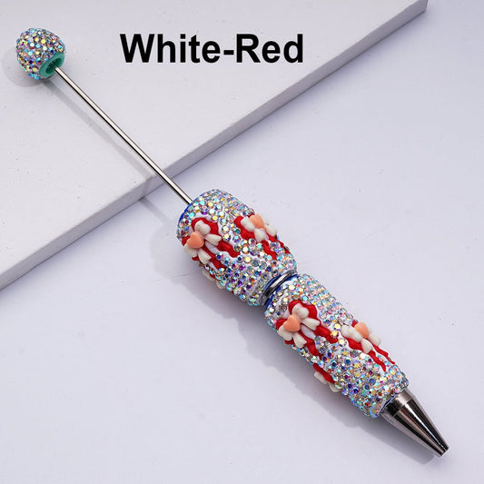 Decorative pen with rhinestones on a white background

