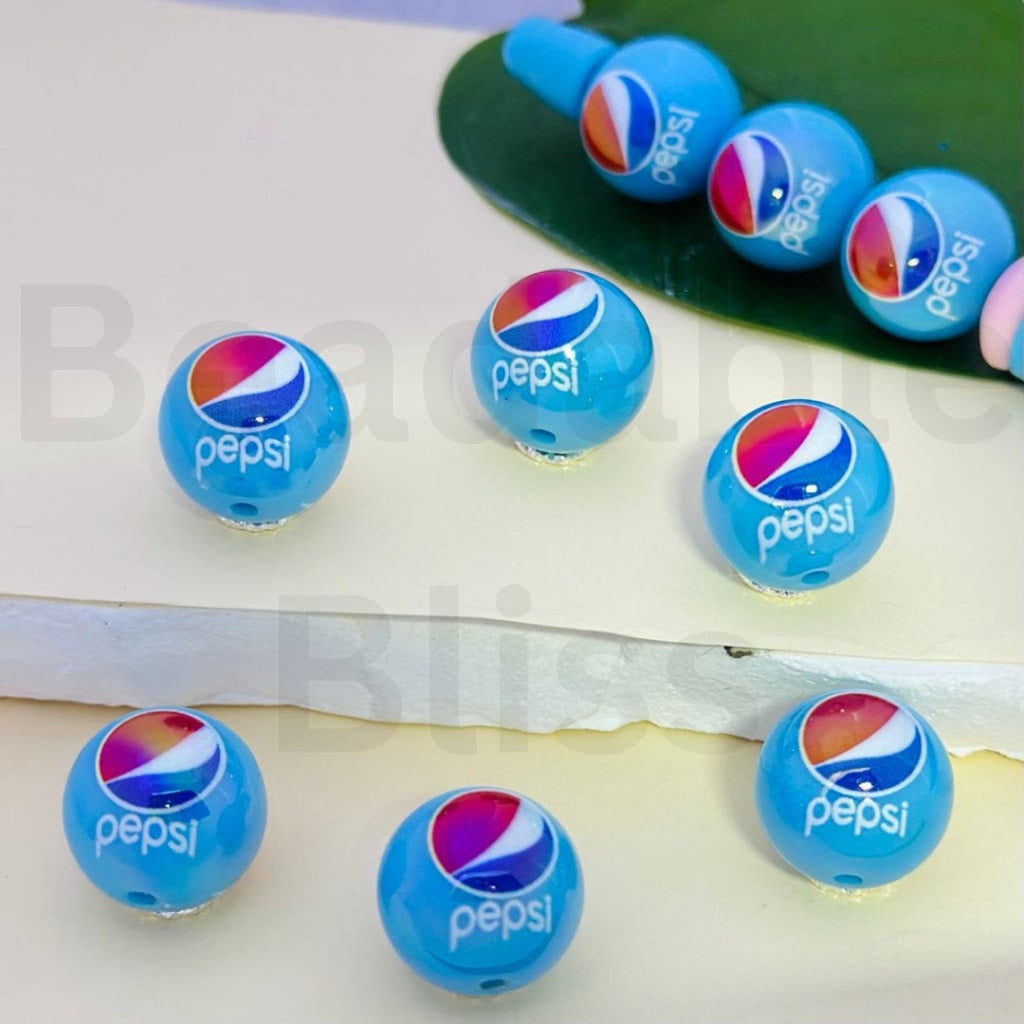 Blue spherical objects with Pepsi logo on a white background

