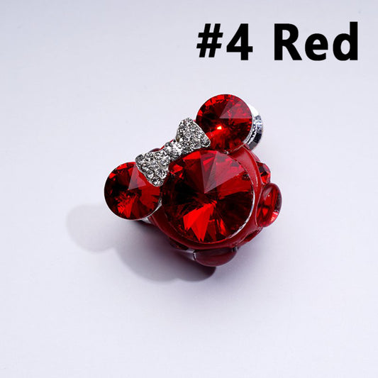 A collection of colorful mouse head-shaped rhinestone embellishments in silver, blue, pink, red, and black colors.

