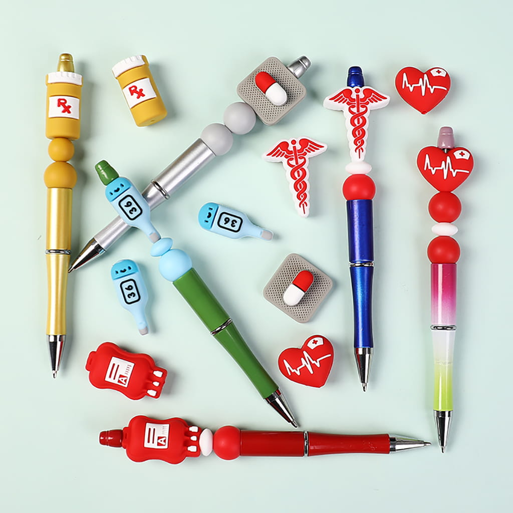 Colorful pens and medical-themed accessories on a light blue background