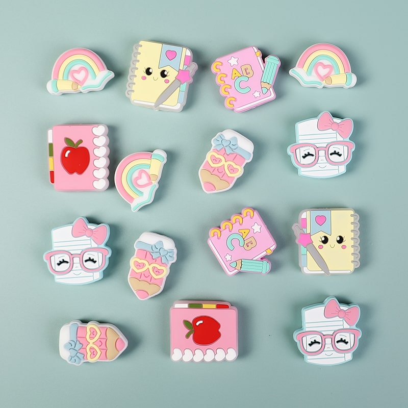 Set of colorful, cartoon-style pins on a light blue background