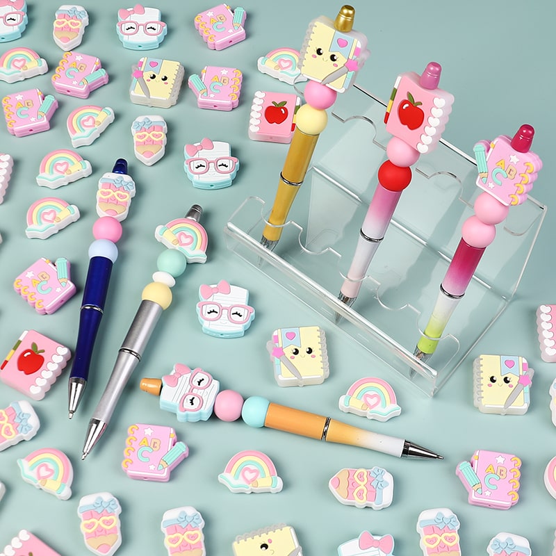 Colorful stationery items including pens and erasers on a light blue background