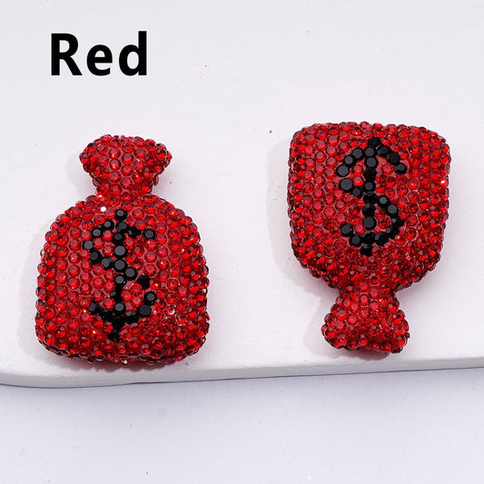 Red rhinestone bag-shaped earrings on a white background with 'Red' text above.

