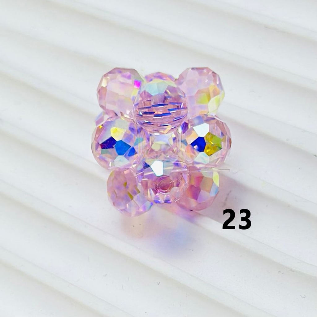 Multicolored beaded hair clip on a white background

