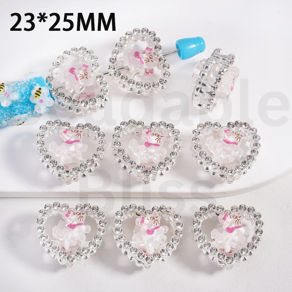 Heart-shaped hair clips with cartoon characters on a white background

