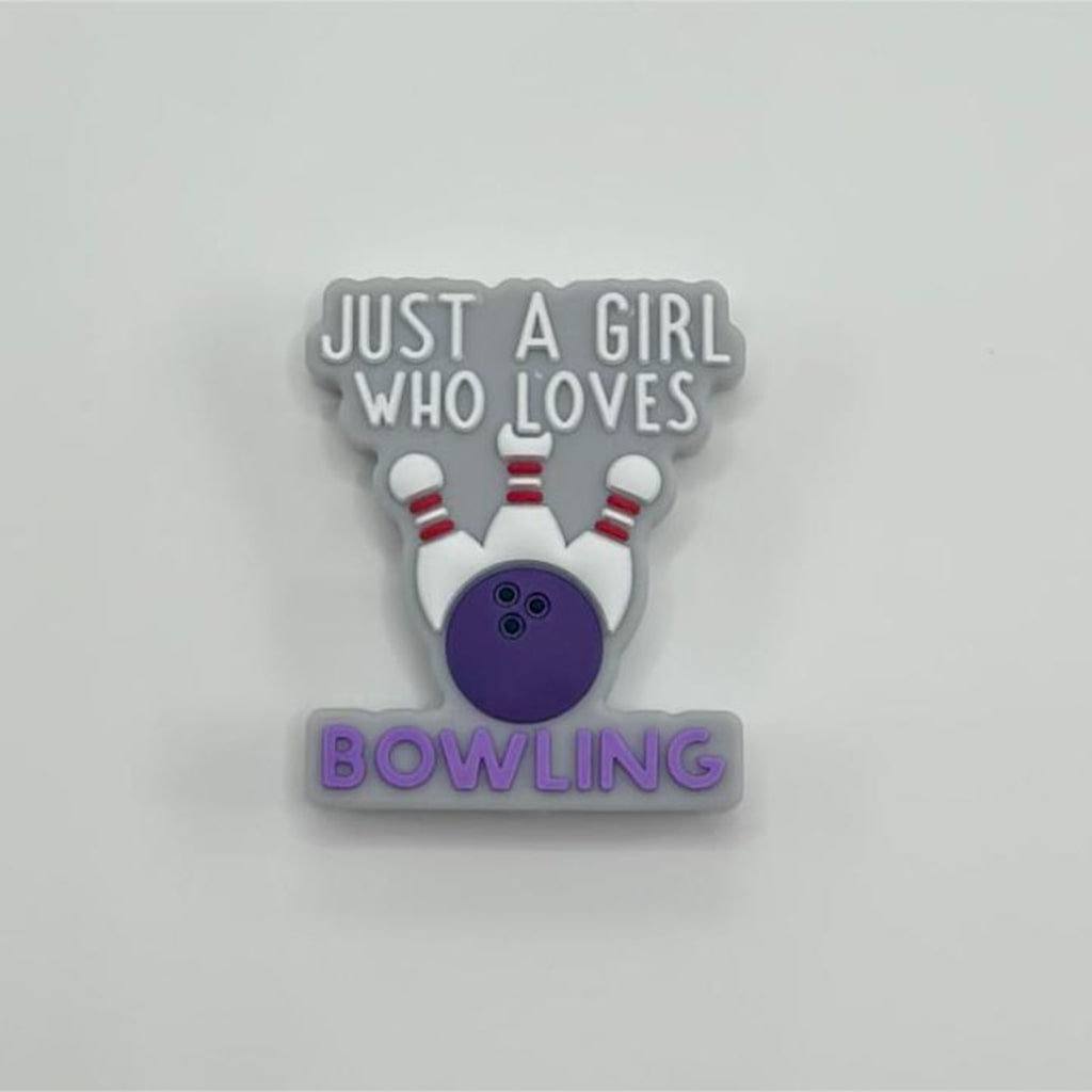 A silicone bead with the text 'JUST A GIRL WHO LOVES BOWLING' and an illustration of a bowling ball and pins.

