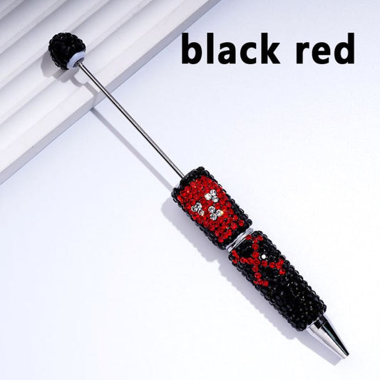A collection of beable clay pens with skull head designs, covered in colorful rhinestones.

