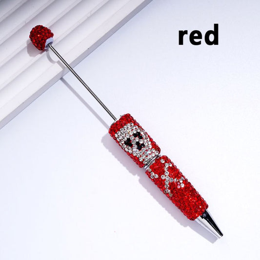 A collection of beable clay pens with skull head designs, covered in colorful rhinestones.

