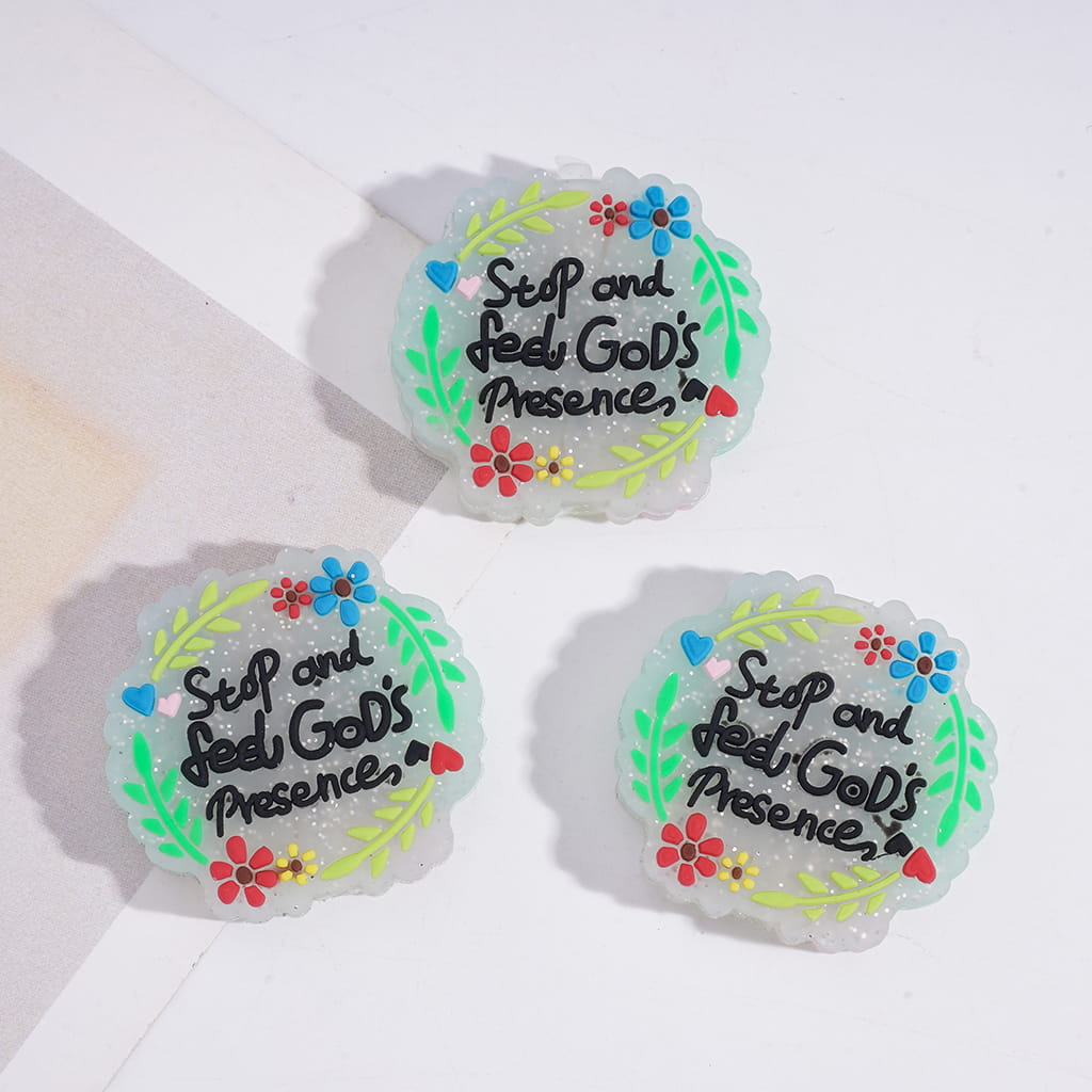 Three circular stickers with floral designs and text on a white background