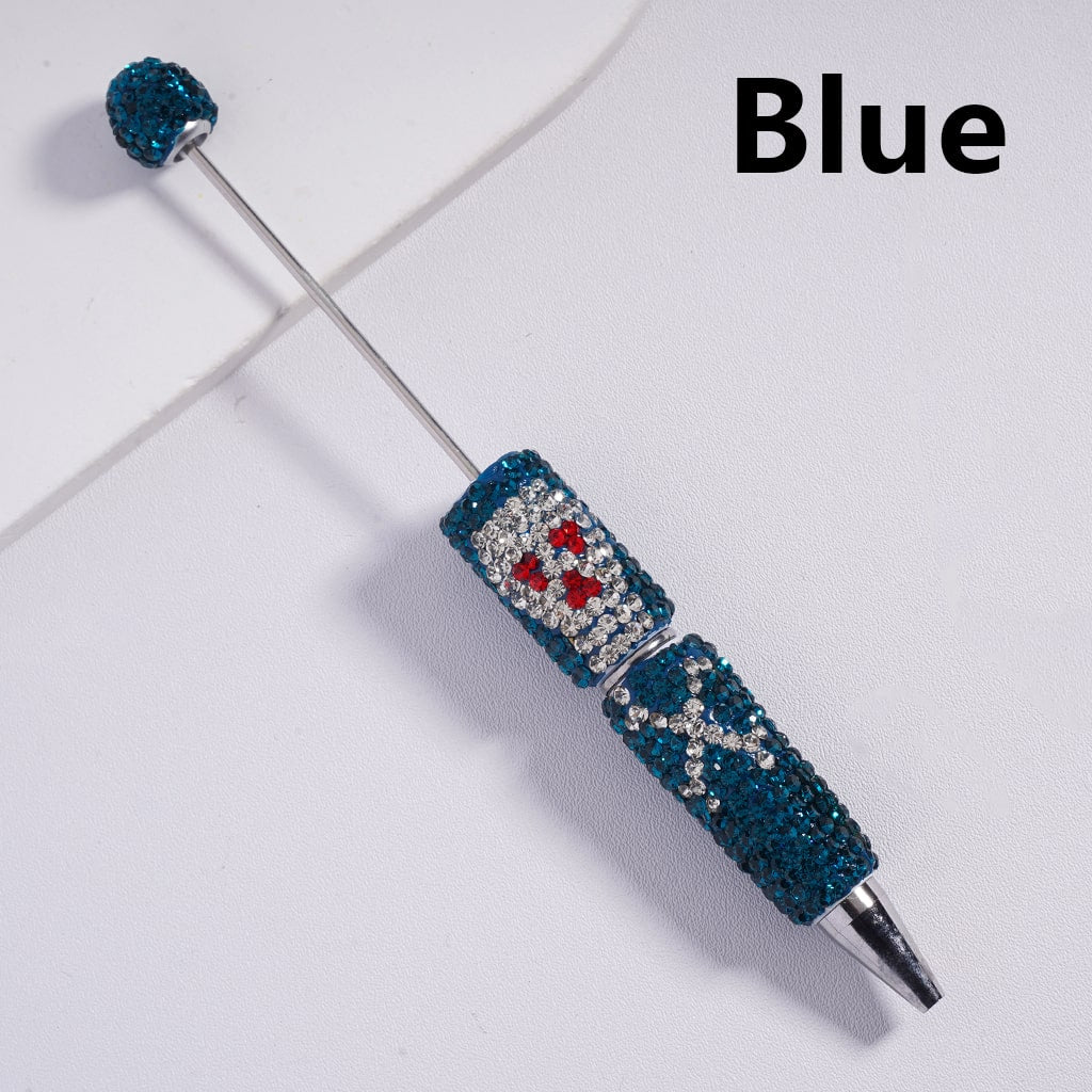 A collection of beable clay pens with skull head designs, covered in colorful rhinestones.

