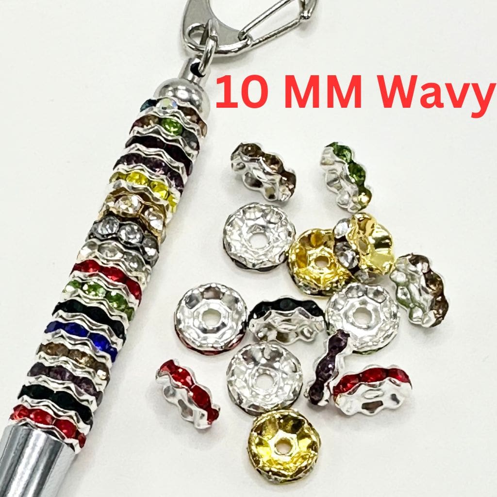 Assorted colorful wavy-shaped metal spacers with rhinestones, intended for use in jewelry making.

