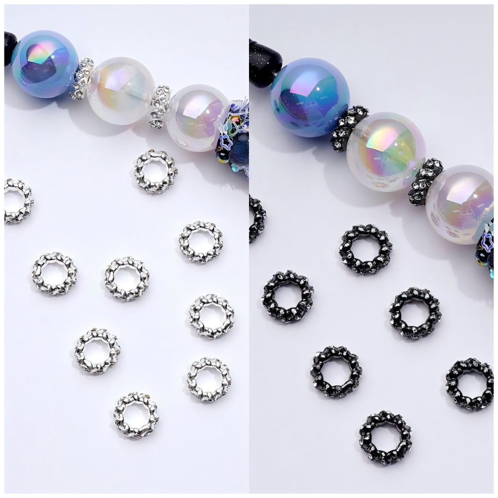 An assortment of round spacer beads in silver and gun black metal with clear rhinestones, displayed alongside a completed bracelet using the beads.

