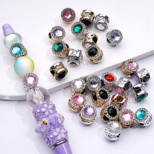 Decorative beads with colorful gemstones on a white background

