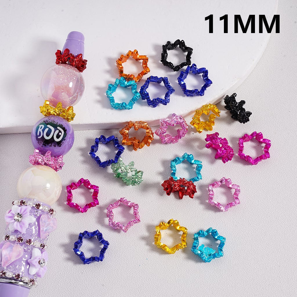 Colorful star-shaped hair ties with a 'BOO' bead on a white background

