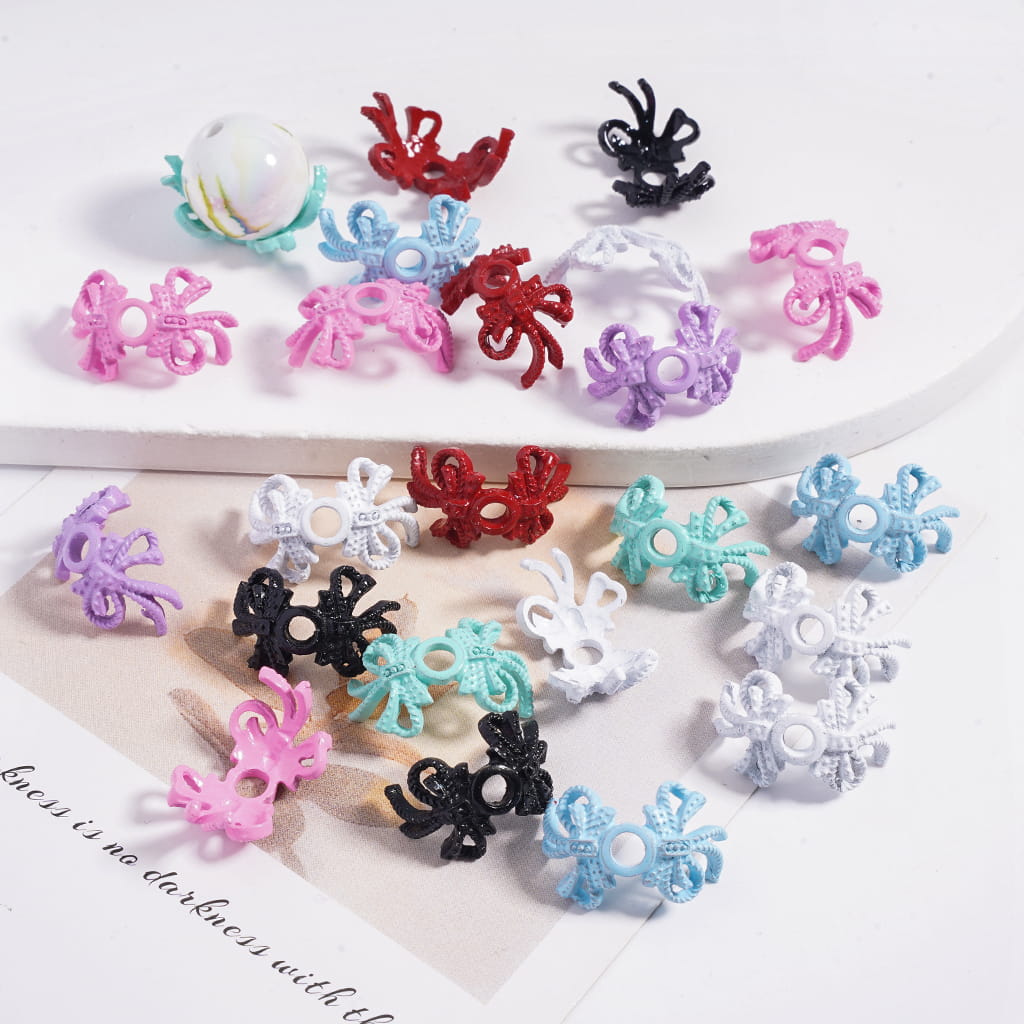 Colorful decorative clips on a white surface with text underneath