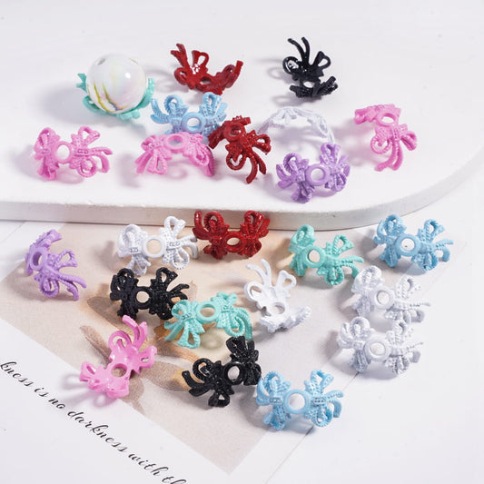 Colorful decorative clips on a white surface with text underneath