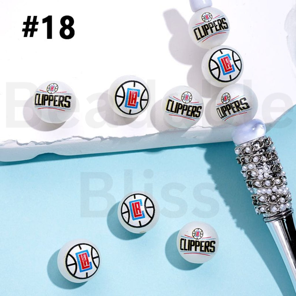 Clippers-themed earrings on a light blue background with 'beadablebliss' branding.

