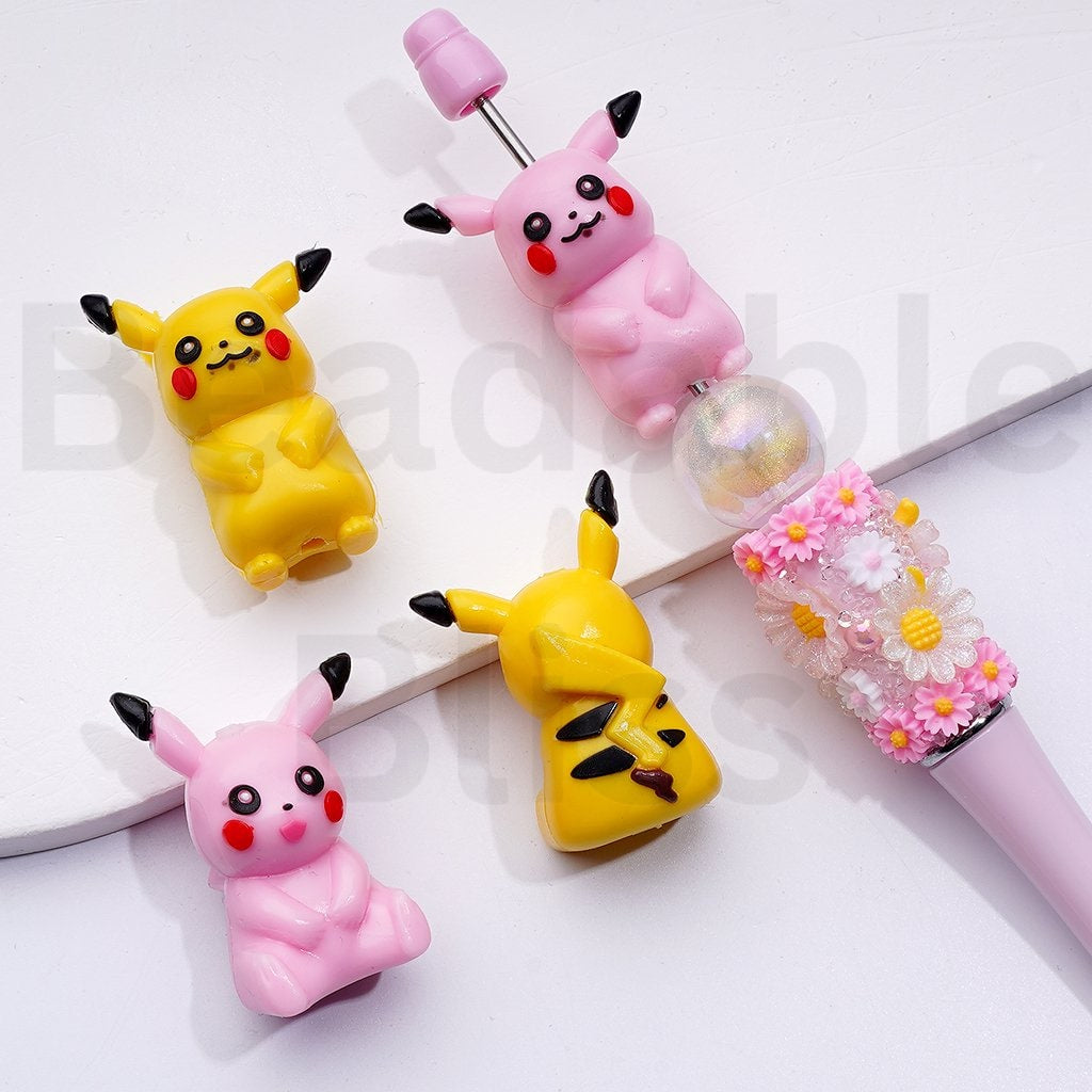 Three cartoon character charms on a white background with 'beadablebliss' branding.

