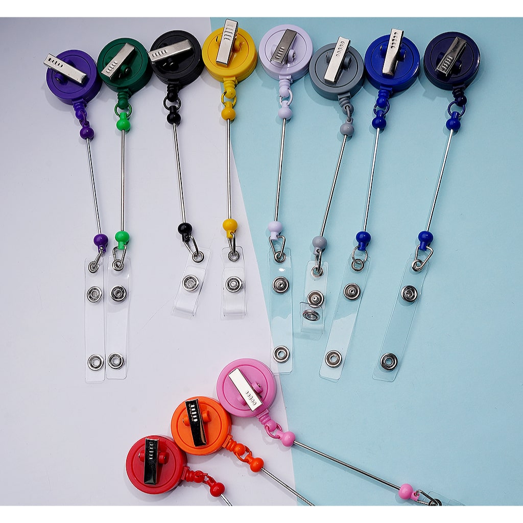 Set of colorful badge holders on a light blue and white background

