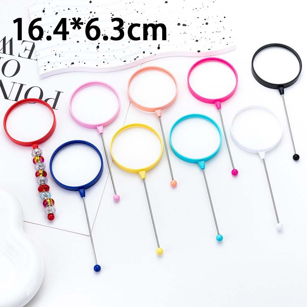 Colorful hair bun makers on sticks with measurement details.

