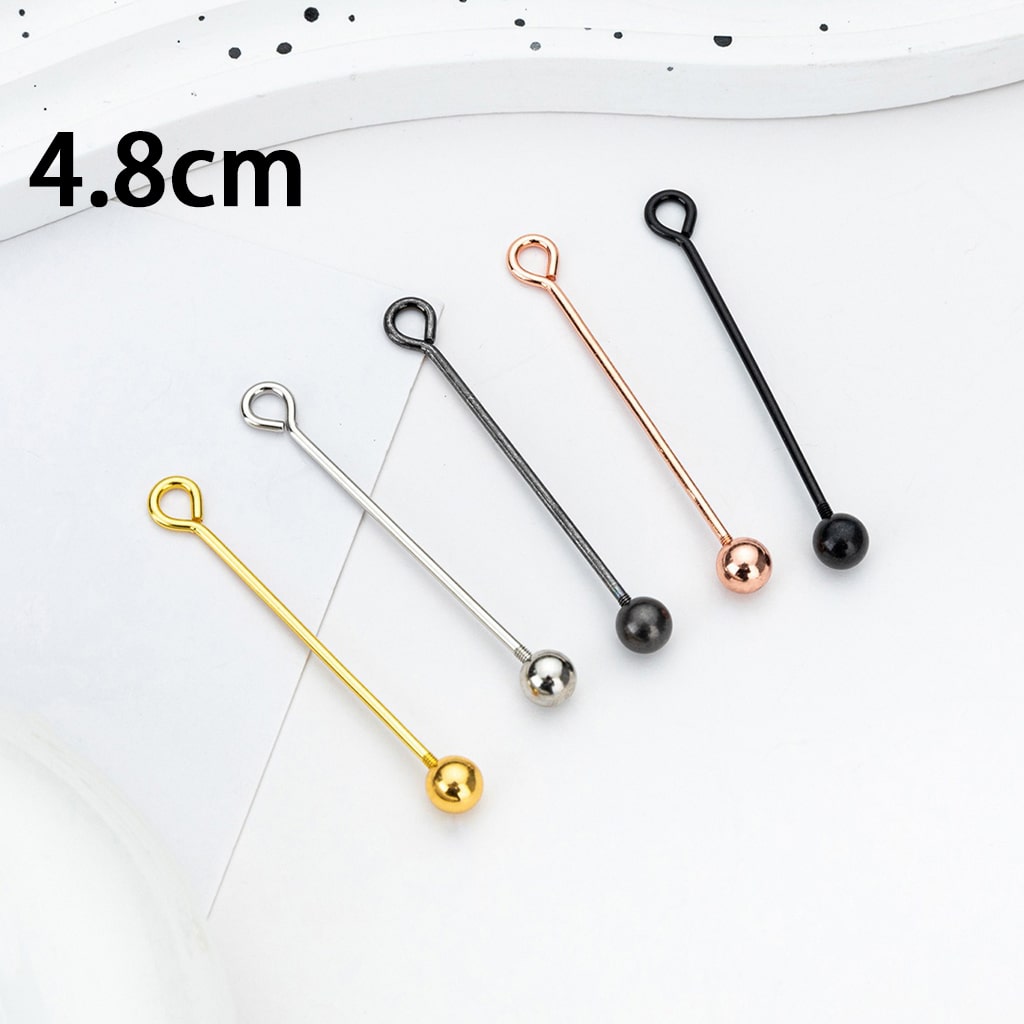 Set of four metal stir sticks in gold, silver, rose gold, and black on a white background with measurement label.

