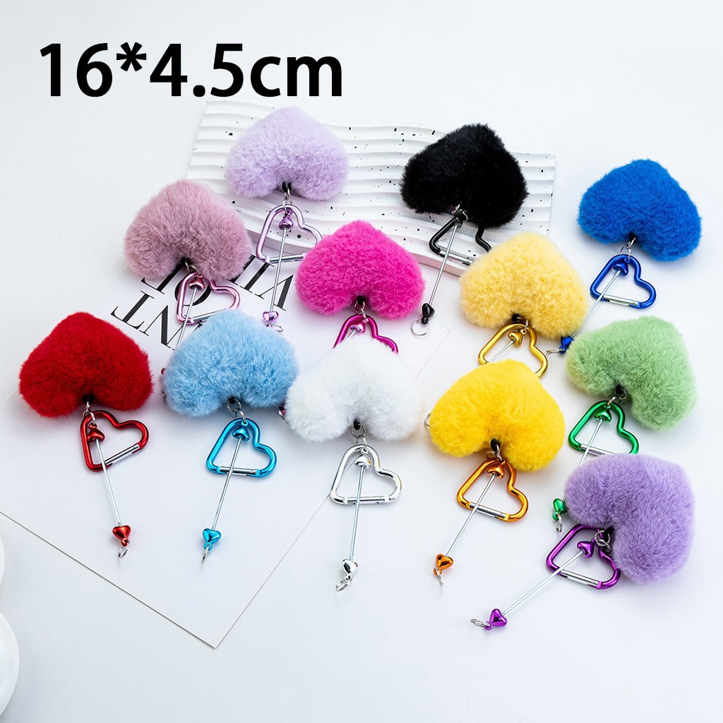 Colorful heart-shaped pom-pom keychains on a white background with size indication.

