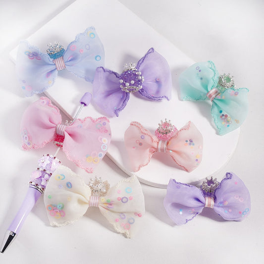 Set of colorful hair bows with decorative elements on a white background

