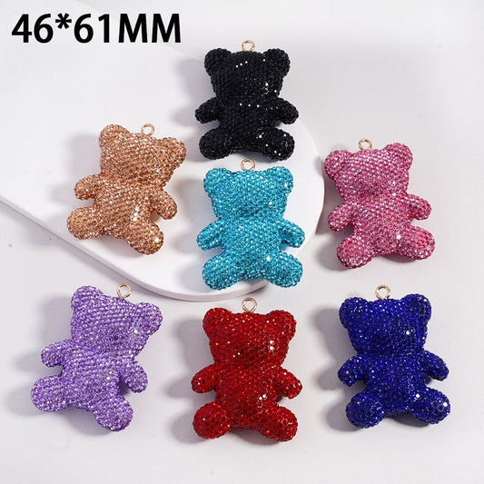 Colorful teddy bear-shaped charms on a white surface with dimensions 46*61MM.

