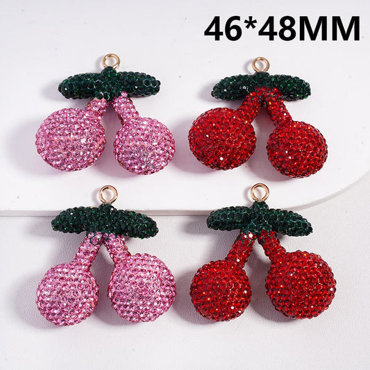 Pair of cherry-shaped earrings with pink and red stones on a white background, labeled 46*48MM.