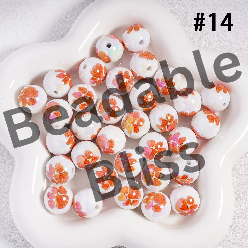 Colorful beads on a white plate with 'Beadable Bliss' branding.


