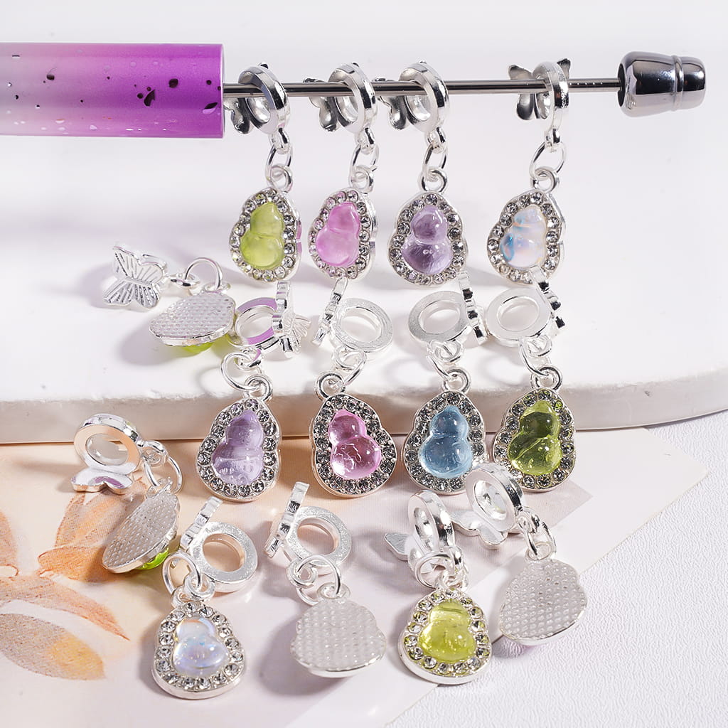 Colorful stitch markers on a knitting needle with a white background