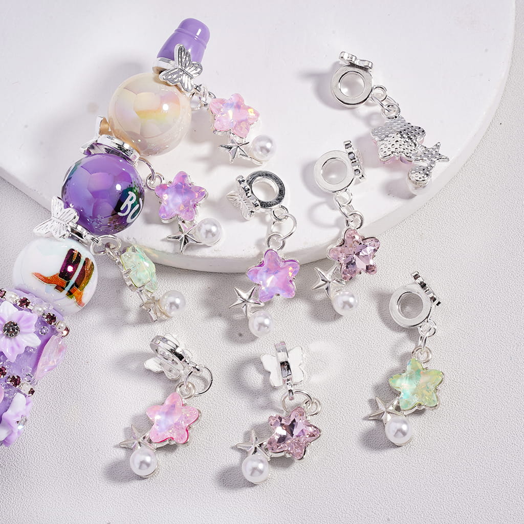 Collection of colorful charm beads on a white background